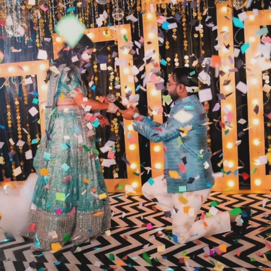 Couple celebrating their ring ceremony beneath falling confetti